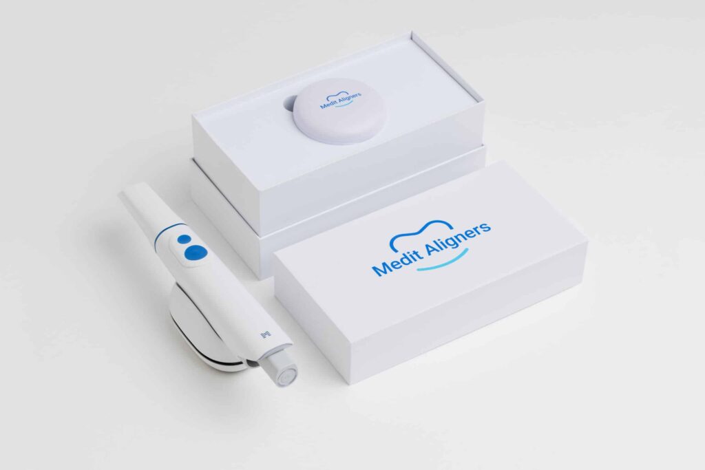 White packaging boxes with the Medit Aligners logo, showing a clean dental aligner kit arrangement.
